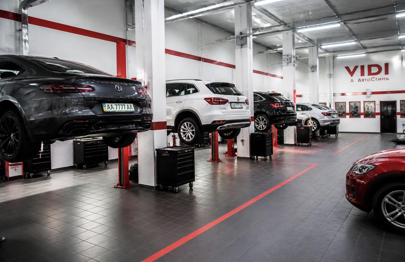 Modern service bay with cars on lifts